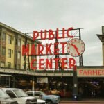 a public market center with cars parked in front of it