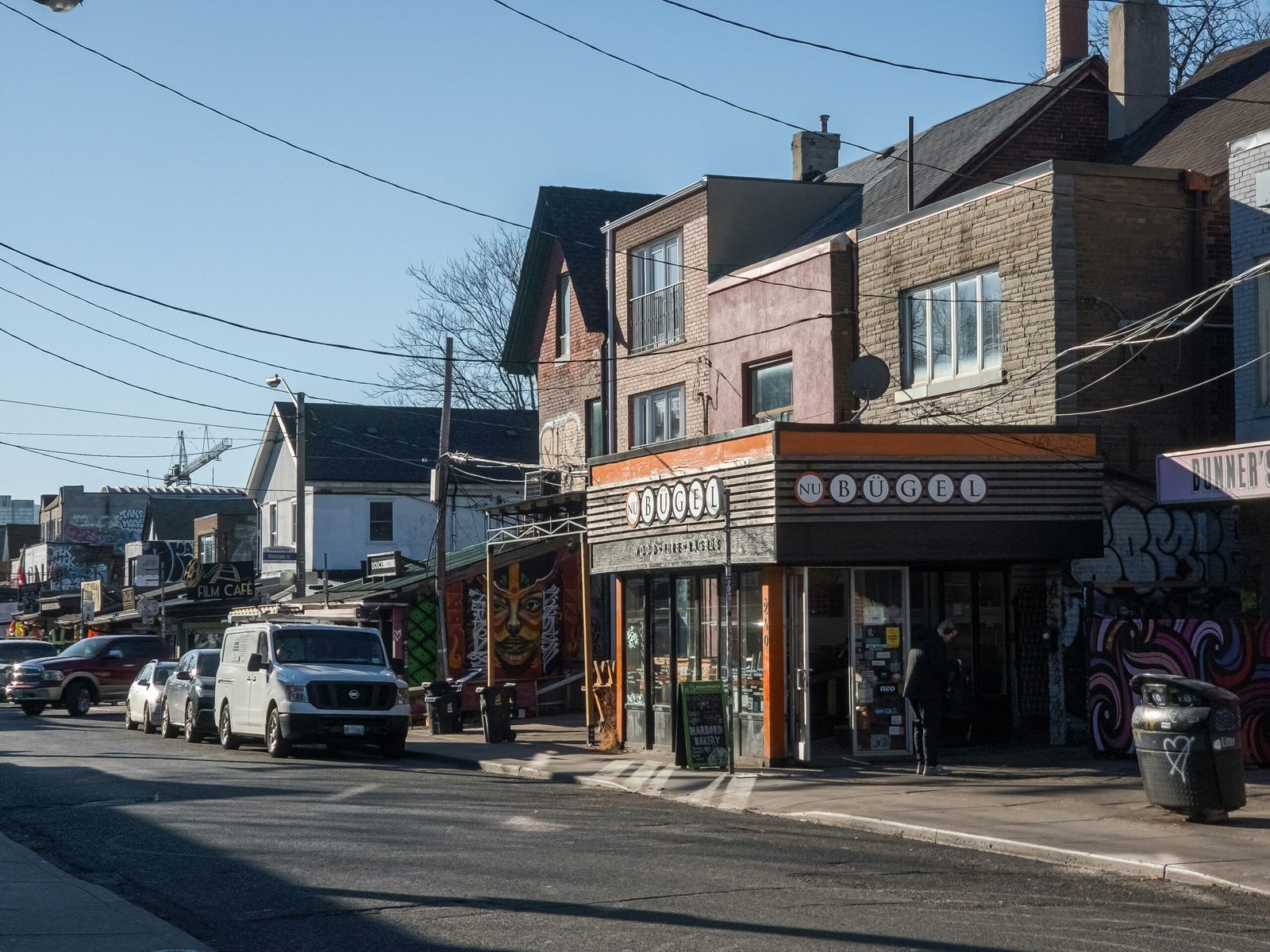 a city street with cars parked on the side of it